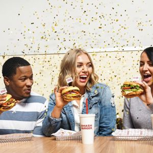 Friends eating burgers